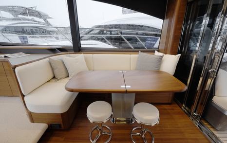 Princess S65 Mk2 main deck dining area with wraparound seating and folding table