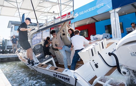Visitors to boat show standing on a boat