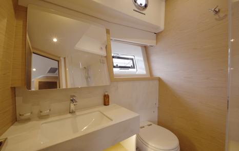 Beneteau Grand Trawler 63 VIP ensuite with separate shower, Corian vanity and natural light