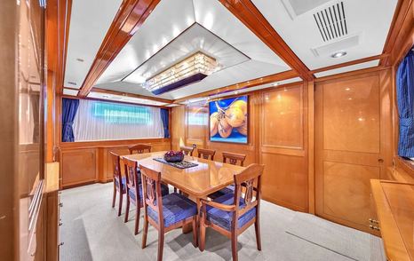 Sanlorenzo motor yacht Cariloy dining room with wooden table 