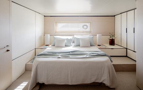 Seadeck 6 cabin features a good-sized bed and handy shelving 