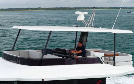 Sirena 48 flybridge helm beneath the hardtop