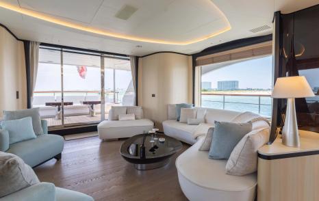 Superyacht Bella Vita main saloon with curved white seating 