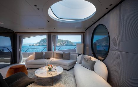 Mangusta 104 REV motor yacht salon curved white seating 