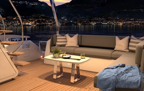 Sunseeker Manhattan 68 motor yacht aft deck L-shaped seating at night