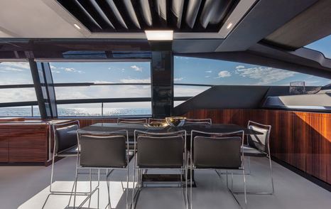 The 88' Folgore's dining area can seat all eight of the yacht's guests.