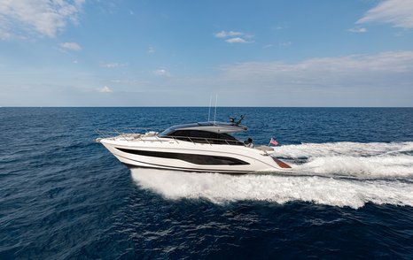 Princess V55 17.81m sportsboat underway at speed with hardtop roof and low-profile V Class design