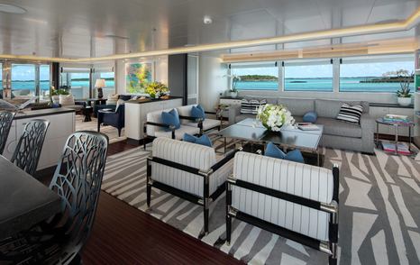 Superyacht Eternity interior with beige and grey seating 