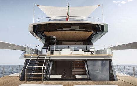 Stern onboard Sanlorenzo SX112 crossover yacht, overview of aft area of yacht with beach club environment and stairs to main deck exteriors