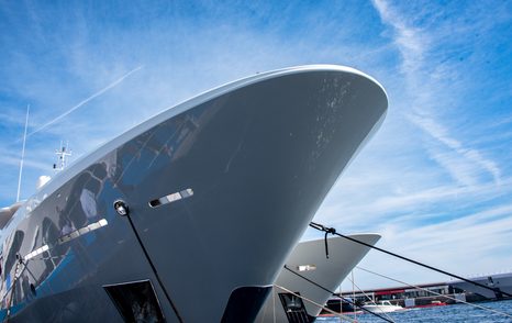 under the bow shot of two superyachts