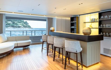 Superyacht Contigo's main saloon with bar 