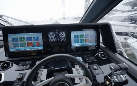 Princess S65 Mk2 lower helm with twin Raymarine displays and central engine screen