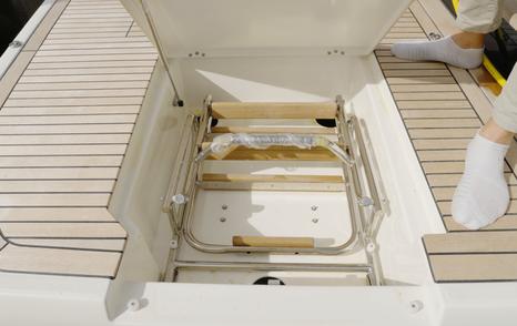 Beneteau Grand Trawler 63 swim platform locker with recessed boarding ladder