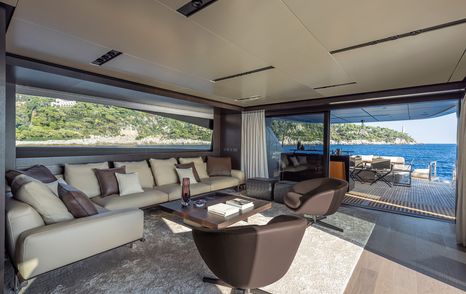 Pershing GTX116 motor yacht interior saloon with L-shaped sofa