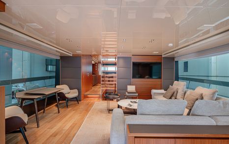 Motor yacht M&M's  main saloon with stair case and L-shaped seating