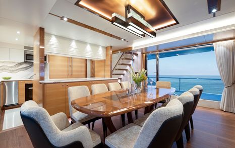 Formal dining area on Crowned Eagle with glass doors adjacent