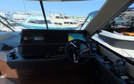 Maritimo M50 flybridge helm dashboard layout with dual screens and steering position
