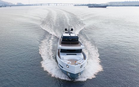 Elevated frontal view of CLX96 bow, underway and heading away from a bridge.