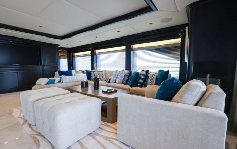 Trinity superyacht Mirabella main saloon seating with white L-shaped sofa