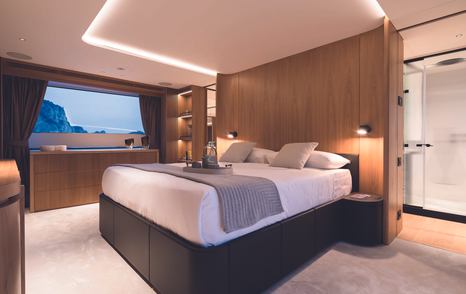 Master cabin onboard Oasis 34M, central berth with window to portside.