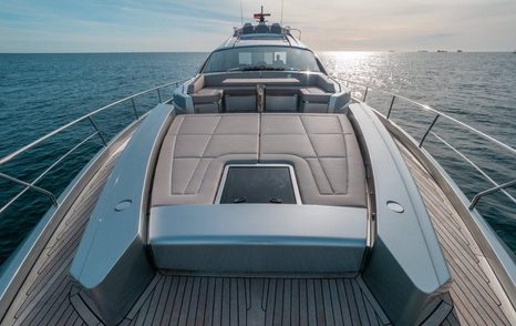 motor yacht Survivor foredeck with sun pads and dining area