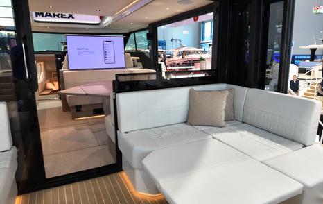 Saxdor-460-GTC-Review-aft-cockpit-sofa-sunpad-and-sliding-glass-doors