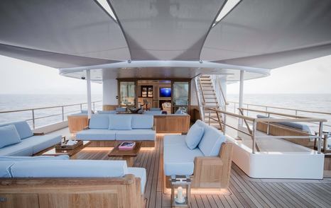 Covered sofas and outdoor seating on explorer yacht Blue II