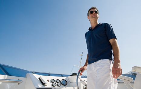 Qualified yacht crew handling a motor yacht during mooring and berthing