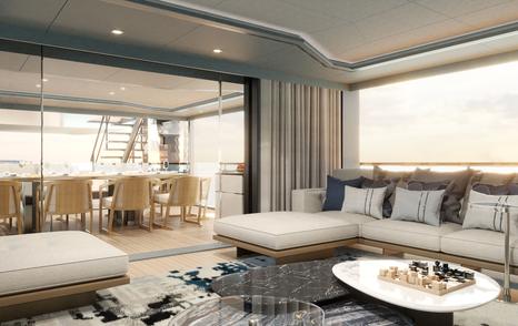 Main saloon on motor yacht Spitfire with cream furnishings and dining area on aft deck