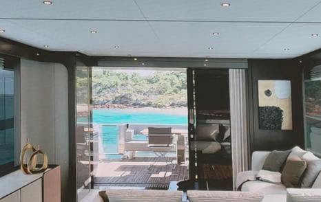 Ferretti 800 motor yacht saloon entrance with glass sliding doors 