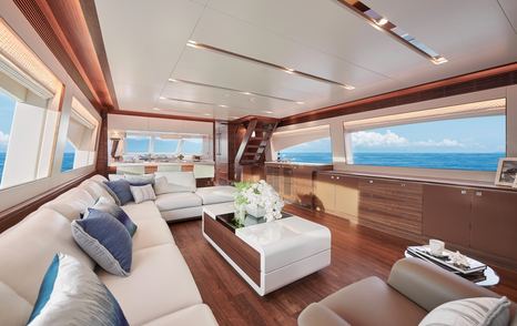 Horizon E90 motor yacht man saloon with L-shaped white sofa 