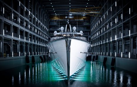 Bow of Bravo Eugenia in Oceanco yacht shed ahead of her launch