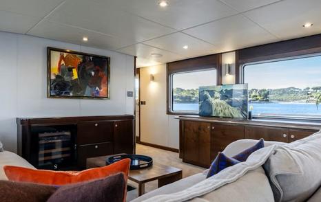 Motor yacht Sultana main saloon view of cabinet and large windows