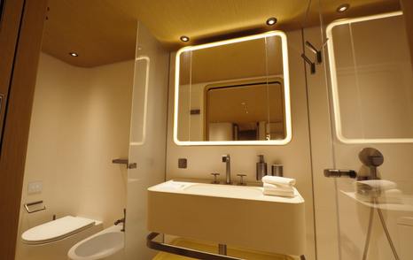 Custom Line Navetta 38 VIP cabin ensuite bathroom with separate shower and modern sink layout