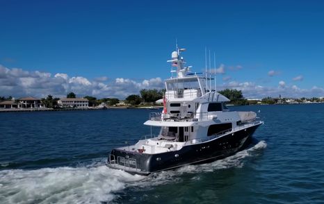 Nordhavn 75 EYF Rhino underway showing tournament fishing cockpit and raised flybridge from the stern quarter