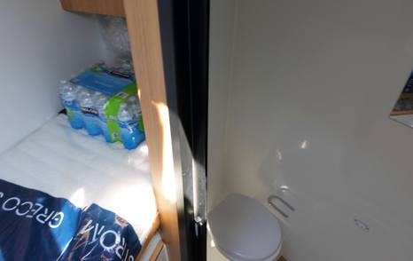 De Antonio D60 crew cabin with compact berth and separate bathroom