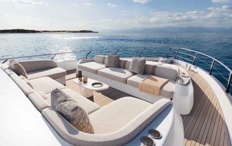 Rendering of Azimut Fly 82 motor yacht foredeck with white seating and coffee table
