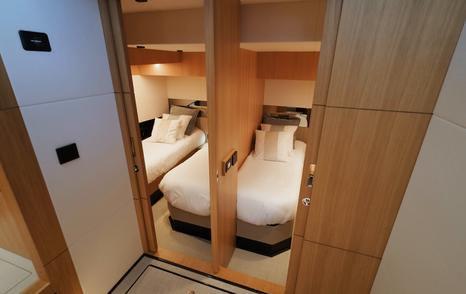 De Antonio D60 guest cabin entrance with convertible twin-to-double cabin layout