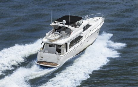 starboard aft aerial shot of fast motor cruising yacht