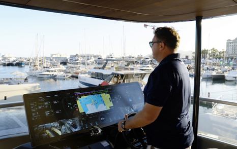 Sunreef Ultima 88 helm console with wide in-house display and steering wheel