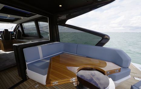 Fairline Targa 58 GTO cockpit seating and dining table beneath hardtop