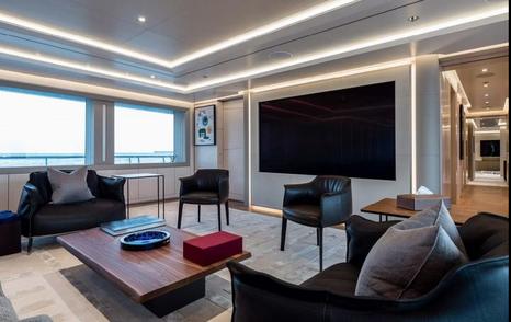 Superyacht Stella MI saloon seating with mounted TV