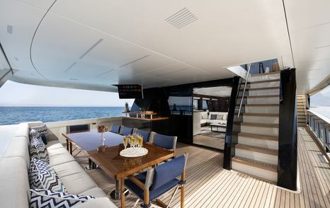 Lazzara UHV 100 Motor Yacht aft deck with shaded alfresco dining