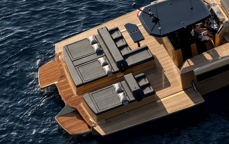 View from above of loungers on wooden decking at back of Sunreef Yachts 40 Open Power tender. 