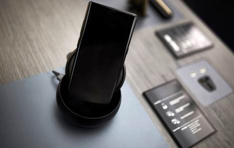 Phone in dock on table