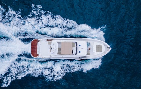 Aerial view of Horizon FD92 tri-deck underway, surrounded by sea