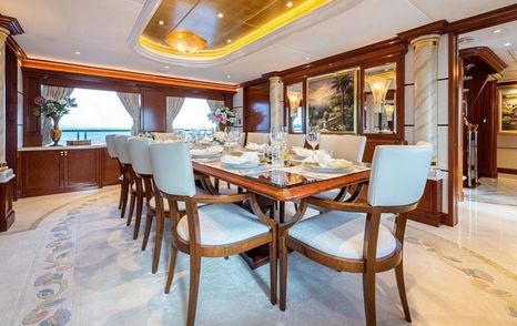 Elegant table and chairs in dining area on Trinity superyacht White Star