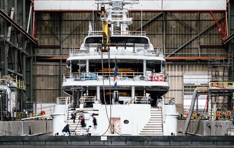Shot of Amels 242 Superyacht Synthesis stern post-refit in shipyard 