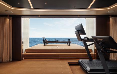 Sanlorenzo 74Steel superyacht Silver Fox indoor gym with fold out terrace 