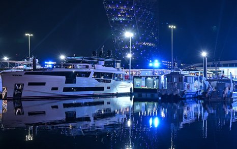 Motor yachts berthed at the ADNEC during the Abu Dhabi International Boat Show at night